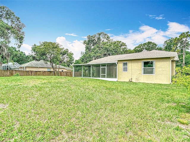 1332 Osceola Hollow Rd, Odessa, FL 33556 - back of house featuring a sunroom and stucco siding
