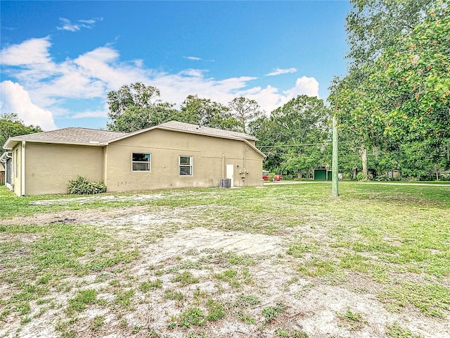 1332 Osceola Hollow Rd, Odessa, FL 33556 - view of home's exterior with stucco siding and a yard