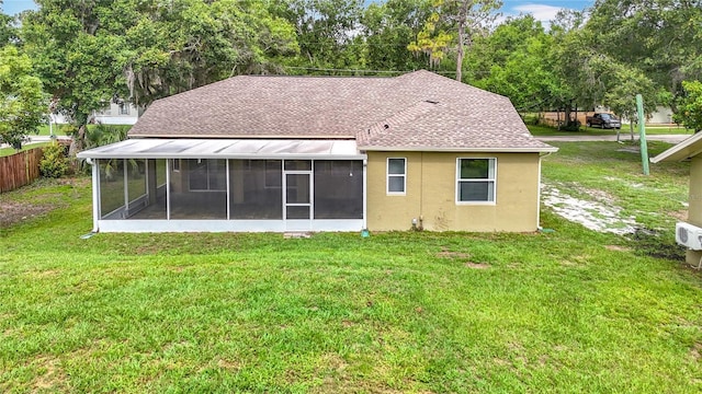1332 Osceola Hollow Rd, Odessa, FL 33556 - rear view of property featuring a sunroom, roof with shingles, and stucco siding