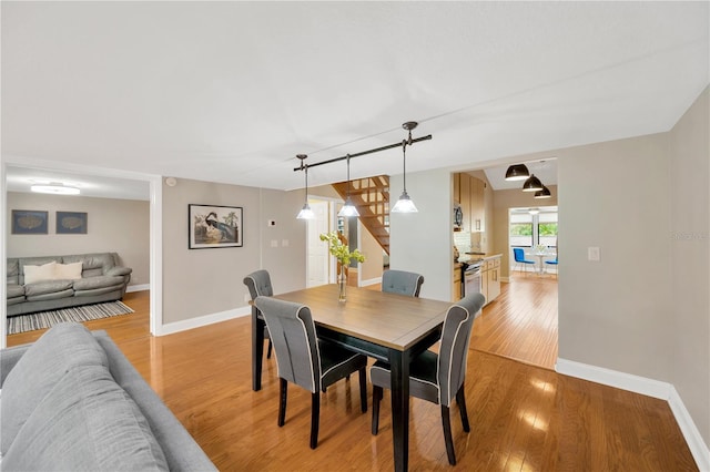 1111 N Bayshore Blvd Unit E10, Clearwater, FL 33759 - dining room with light wood-style floors and stairway