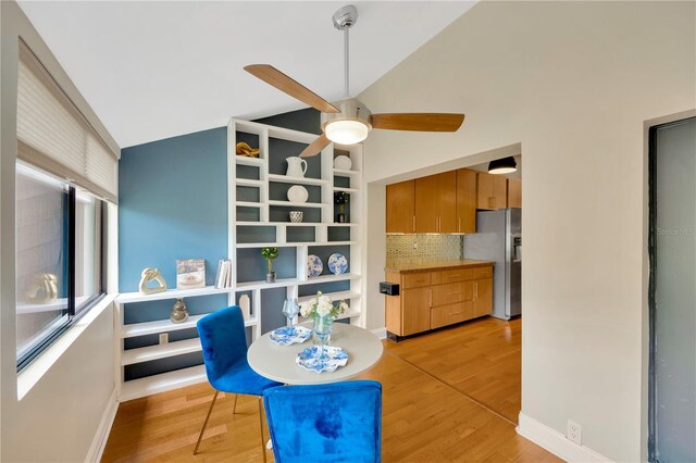 1111 N Bayshore Blvd Unit E10, Clearwater, FL 33759 - dining area with ceiling fan, light wood-style flooring, and high vaulted ceiling