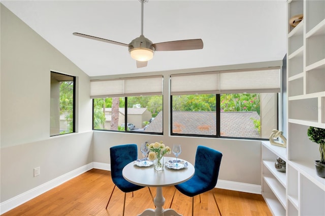 1111 N Bayshore Blvd Unit E10, Clearwater, FL 33759 - dining area with a ceiling fan, wood finished floors, and vaulted ceiling