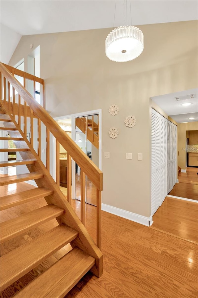 1111 N Bayshore Blvd Unit E10, Clearwater, FL 33759 - stairs with wood finished floors and high vaulted ceiling