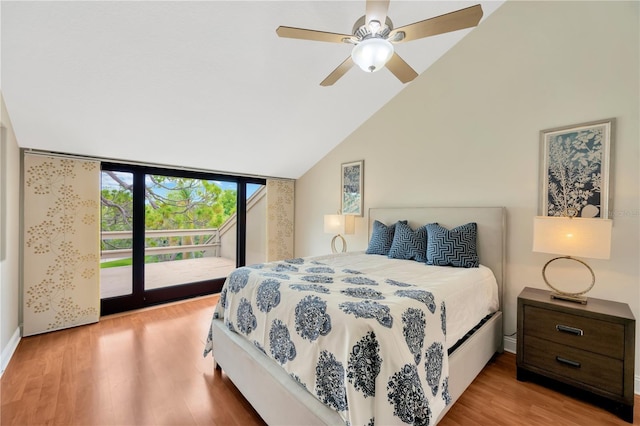 1111 N Bayshore Blvd Unit E10, Clearwater, FL 33759 - bedroom featuring access to exterior, wood finished floors, vaulted ceiling, ceiling fan, and expansive windows