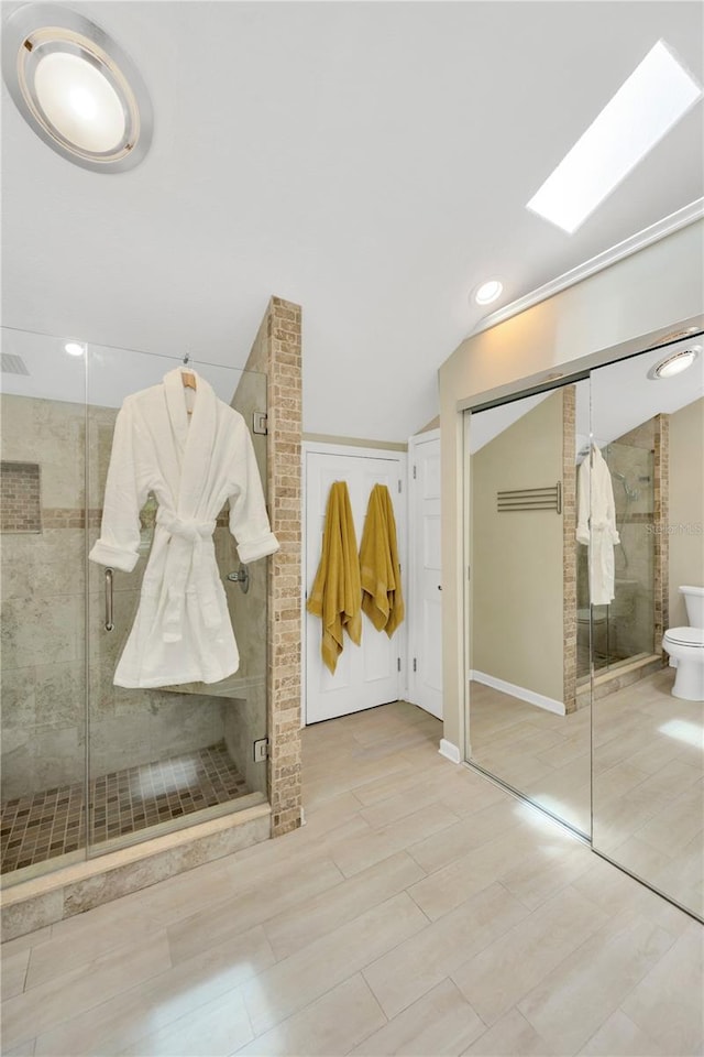 1111 N Bayshore Blvd Unit E10, Clearwater, FL 33759 - full bathroom featuring a shower stall, lofted ceiling, and recessed lighting