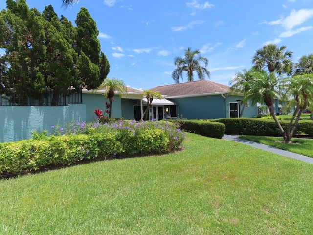 364 115th Ave N Unit 1, Saint Petersburg, FL 33716 - view of front of house with a front lawn and stucco siding