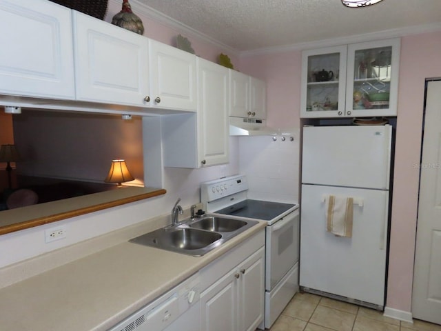 364 115th Ave N Unit 1, Saint Petersburg, FL 33716 - kitchen with white appliances, white cabinets, under cabinet range hood, glass insert cabinets, and light tile patterned floors