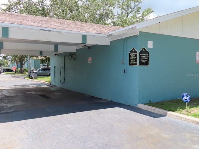 364 115th Ave N Unit 1, Saint Petersburg, FL 33716 - view of building exterior featuring a carport