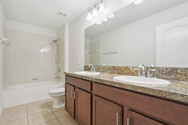 1893 Rafton Rd, Apopka, FL 32703 - bathroom featuring toilet, shower / tub combination, tile patterned flooring, and double vanity