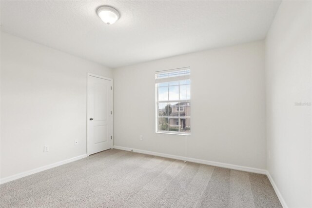 1893 Rafton Rd, Apopka, FL 32703 - empty room with baseboards and light carpet