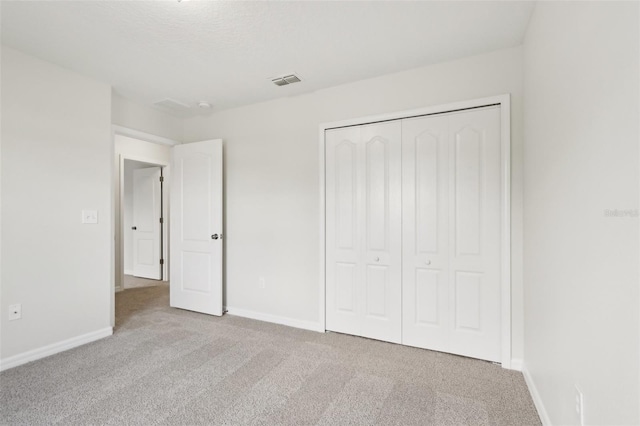 1893 Rafton Rd, Apopka, FL 32703 - unfurnished bedroom featuring carpet flooring, baseboards, and a closet