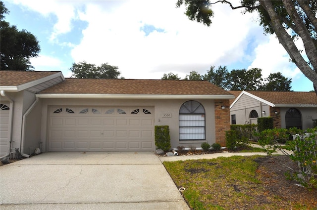 5530 Salem Square Dr N, Palm Harbor, FL 34685 - single story home featuring concrete driveway, an attached garage, and stucco siding
