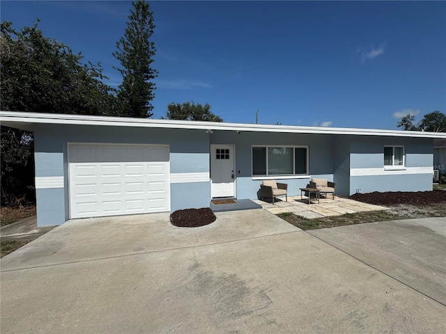 814 19th St SW, Largo, FL 33770 - single story home featuring a garage, stucco siding, and driveway