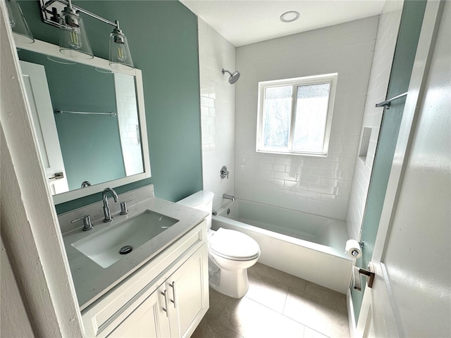 814 19th St SW, Largo, FL 33770 - full bathroom with vanity, toilet, tile patterned flooring, and shower / washtub combination