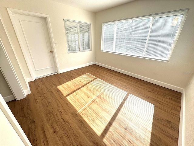 814 19th St SW, Largo, FL 33770 - unfurnished room featuring wood finished floors and baseboards