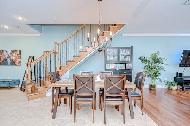 1411 Tessano Pl, Palm Harbor, FL 34683 - dining room featuring crown molding, stairway, baseboards, and recessed lighting