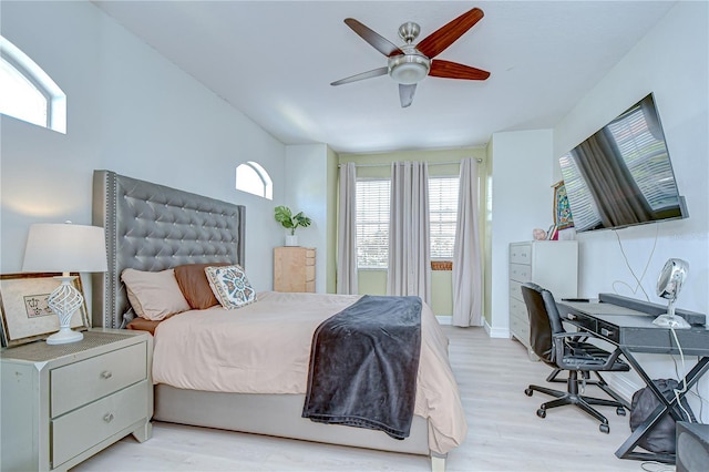 1411 Tessano Pl, Palm Harbor, FL 34683 - bedroom with light wood finished floors, a desk, ceiling fan, and baseboards