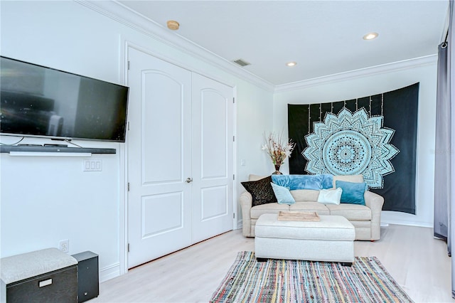 1411 Tessano Pl, Palm Harbor, FL 34683 - living area with wood finished floors, ornamental molding, recessed lighting, and baseboards
