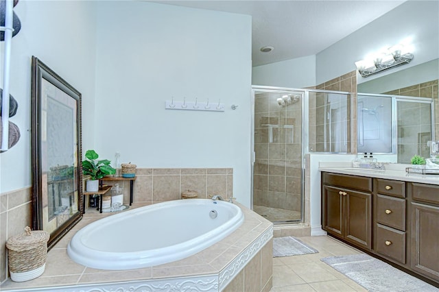 1411 Tessano Pl, Palm Harbor, FL 34683 - full bathroom with a bath, vanity, a shower stall, and tile patterned floors