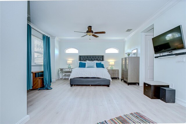 1411 Tessano Pl, Palm Harbor, FL 34683 - bedroom with crown molding, light wood-style floors, baseboards, and a ceiling fan