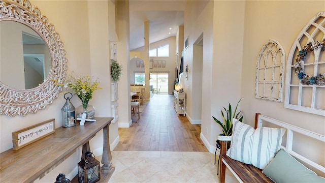 9800 Sago Point Dr, Seminole, FL 33777 - entryway with a towering ceiling, baseboards, wood finished floors, and recessed lighting