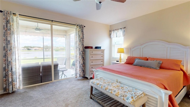 9800 Sago Point Dr, Seminole, FL 33777 - carpeted bedroom featuring access to outside, a ceiling fan, and a water view