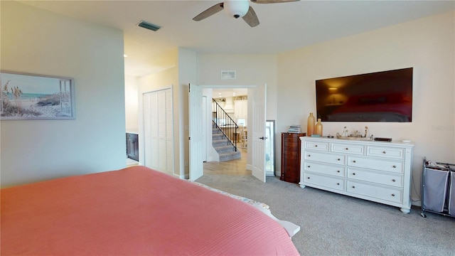 9800 Sago Point Dr, Seminole, FL 33777 - bedroom featuring light carpet and ceiling fan