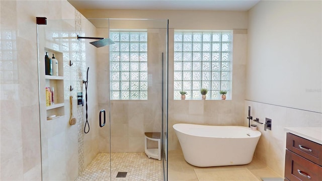 9800 Sago Point Dr, Seminole, FL 33777 - bathroom featuring healthy amount of natural light, vanity, and a freestanding bath