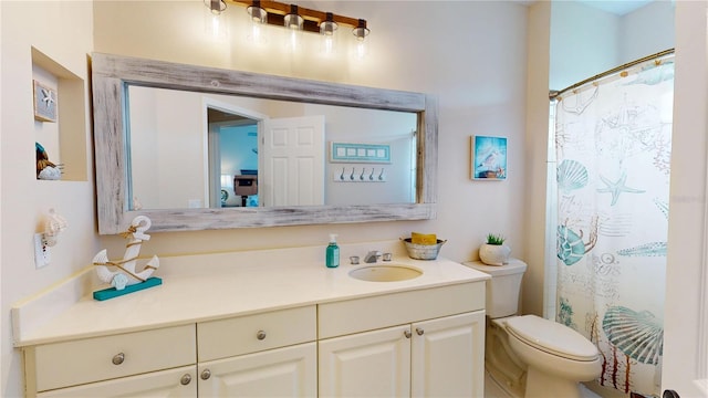 9800 Sago Point Dr, Seminole, FL 33777 - bathroom with vanity, toilet, and a shower with curtain