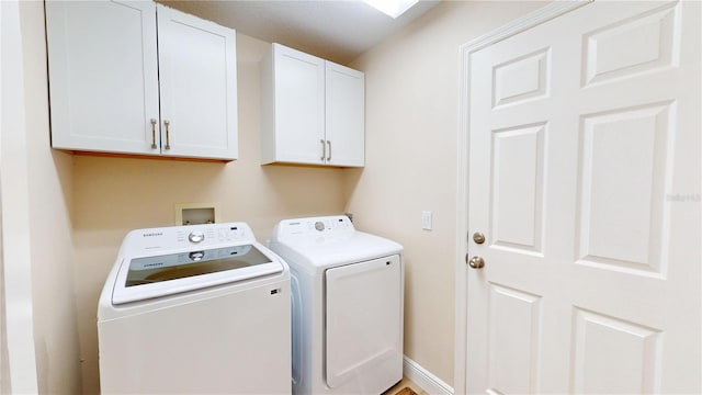 9800 Sago Point Dr, Seminole, FL 33777 - washroom featuring washer and clothes dryer and cabinet space