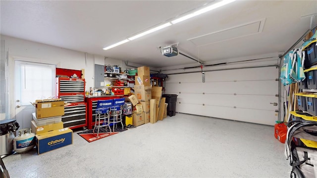 9800 Sago Point Dr, Seminole, FL 33777 - garage featuring a garage door opener and electric panel