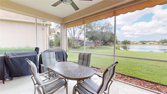 9800 Sago Point Dr, Seminole, FL 33777 - sunroom / solarium with a water view, ceiling fan, and outdoor dining area