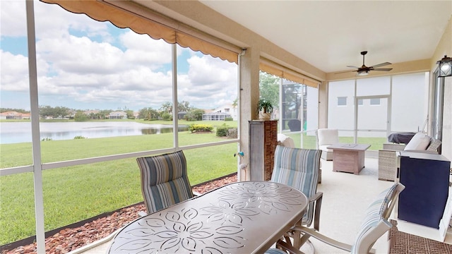 9800 Sago Point Dr, Seminole, FL 33777 - sunroom with a water view, outdoor dining area, and ceiling fan