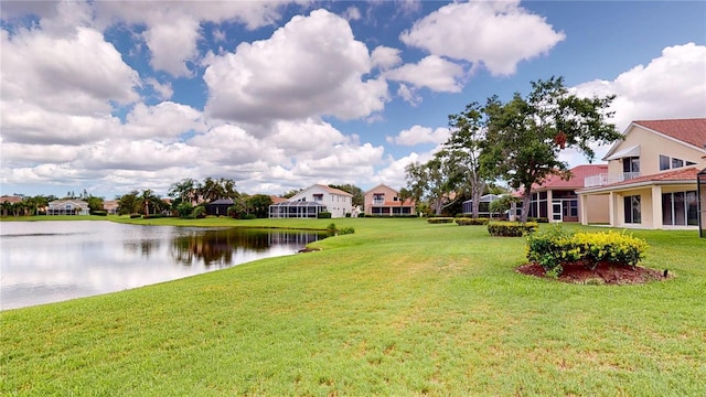 9800 Sago Point Dr, Seminole, FL 33777 - view of grassy yard featuring a water view and a residential view