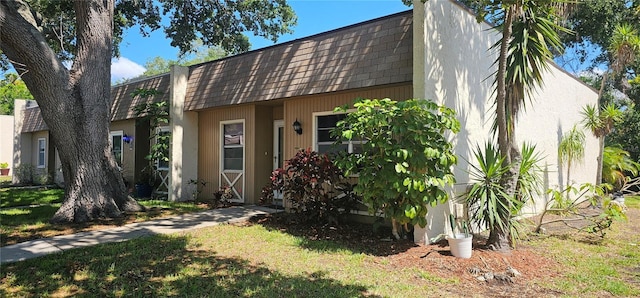 11511 113th St Unit 4F, Seminole, FL 33778 - view of front of house featuring mansard roof