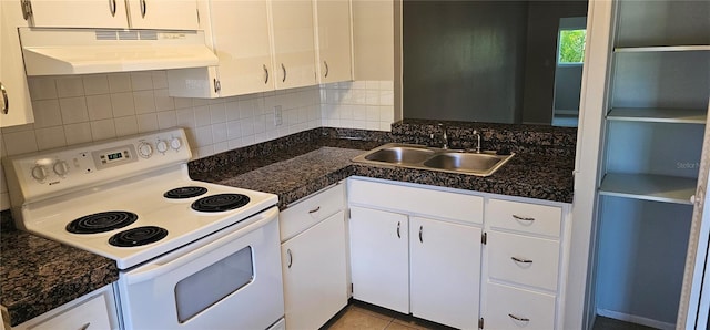 11511 113th St Unit 4F, Seminole, FL 33778 - kitchen with electric range, under cabinet range hood, a sink, and white cabinets