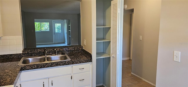 11511 113th St Unit 4F, Seminole, FL 33778 - bathroom featuring tile patterned flooring, vanity, and baseboards