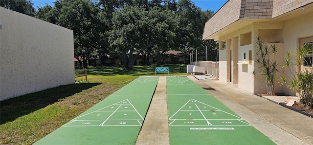 11511 113th St Unit 4F, Seminole, FL 33778 - view of property's community with a lawn and shuffleboard