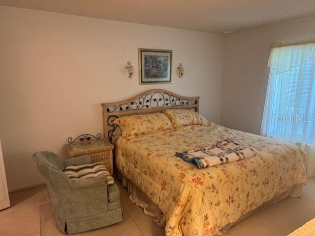 1258 Pine Ridge Cir W Unit F1, Tarpon Springs, FL 34688 - bedroom featuring carpet floors
