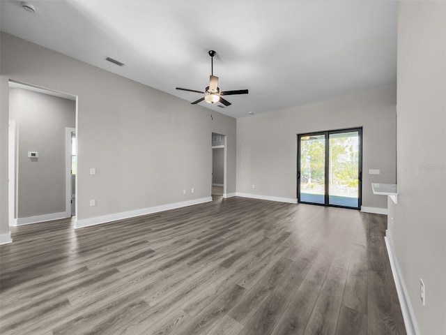 5104 Munhal St, Port Charlotte, FL 33981 - unfurnished living room with wood finished floors, a ceiling fan, and baseboards