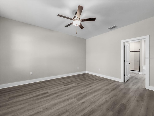 5104 Munhal St, Port Charlotte, FL 33981 - unfurnished room with ceiling fan, dark wood finished floors, and baseboards