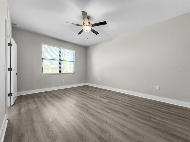 5104 Munhal St, Port Charlotte, FL 33981 - unfurnished room with a ceiling fan, wood finished floors, and baseboards