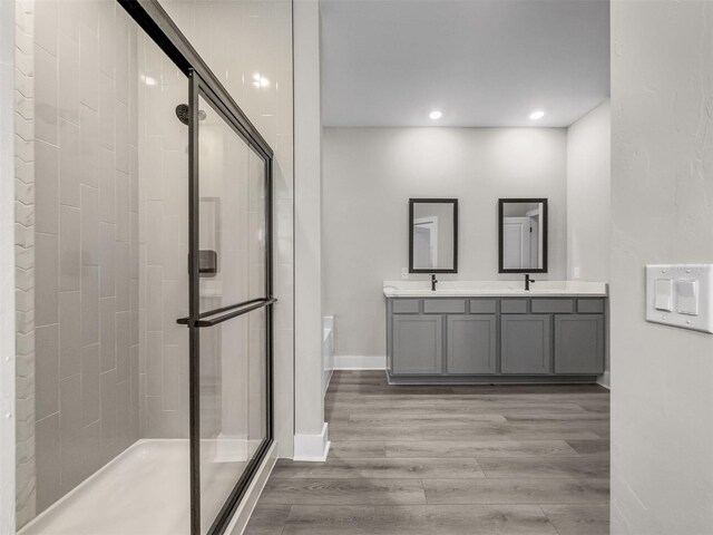5104 Munhal St, Port Charlotte, FL 33981 - full bath featuring a shower stall, a bath, double vanity, wood finished floors, and recessed lighting