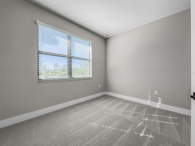 5104 Munhal St, Port Charlotte, FL 33981 - spare room with baseboards and carpet floors