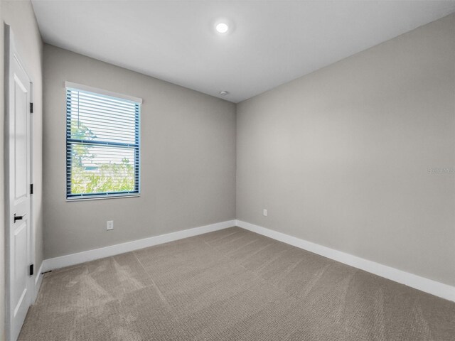 5104 Munhal St, Port Charlotte, FL 33981 - carpeted spare room featuring baseboards