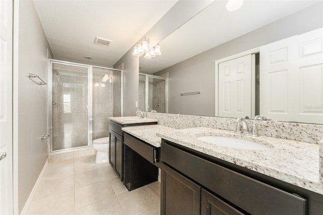 9140 Hillcroft Dr, Riverview, FL 33578 - bathroom featuring double vanity, tile patterned flooring, toilet, a stall shower, and baseboards