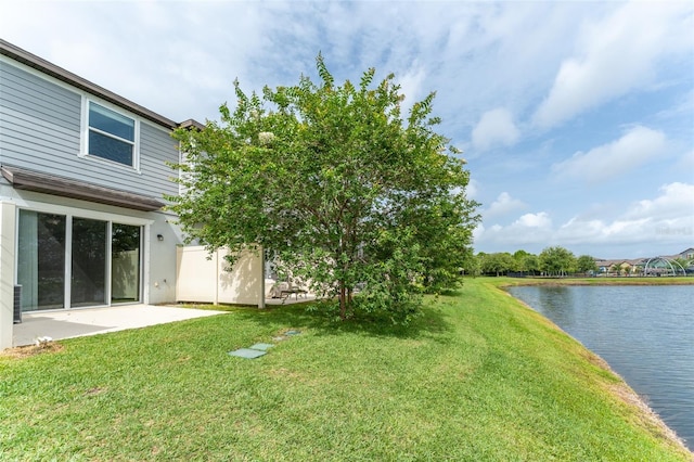 9140 Hillcroft Dr, Riverview, FL 33578 - view of green lawn with a water view and a patio area
