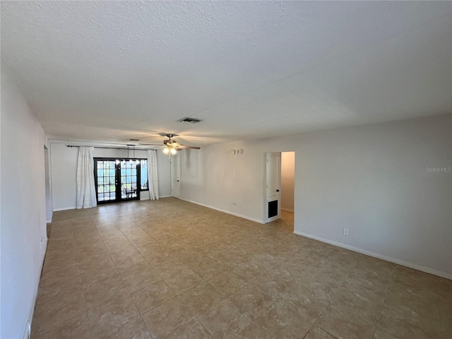 422 Crosswinds Dr, Palm Harbor, FL 34683 - spare room with french doors, a ceiling fan, baseboards, and a textured ceiling