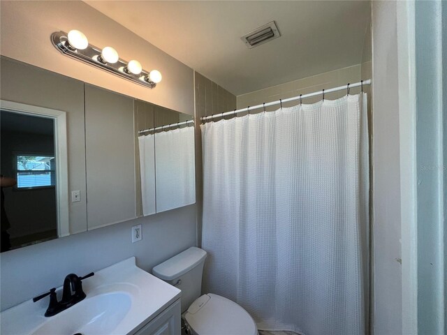 422 Crosswinds Dr, Palm Harbor, FL 34683 - bathroom featuring vanity, toilet, and a shower with shower curtain