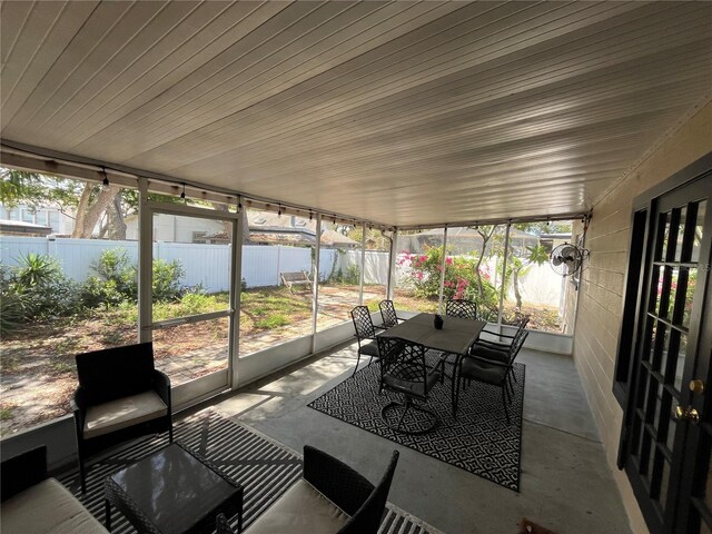 422 Crosswinds Dr, Palm Harbor, FL 34683 - sunroom with outdoor dining space